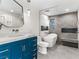 Elegant bathroom with blue vanity and freestanding tub at 2800 Ashby Ave, Las Vegas, NV 89102