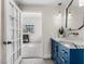 Modern bathroom with blue vanity and marble countertop at 2800 Ashby Ave, Las Vegas, NV 89102