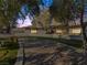 Single story home with a long driveway and landscaping at dusk at 2800 Ashby Ave, Las Vegas, NV 89102