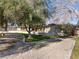 Ranch style home with a curved driveway and landscaping at 2800 Ashby Ave, Las Vegas, NV 89102