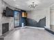 Gathering room with fireplace, wall-mounted TV, and artistic wallcovering at 2800 Ashby Ave, Las Vegas, NV 89102