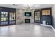 Gathering room features a fireplace, built-ins, and access to backyard at 2800 Ashby Ave, Las Vegas, NV 89102