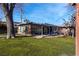 Rustic-style guesthouse with wooden exterior and patio at 2800 Ashby Ave, Las Vegas, NV 89102