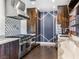 Modern kitchen with stainless steel appliances and dark wood cabinets at 2800 Ashby Ave, Las Vegas, NV 89102
