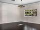 Living room with hardwood floors and large window at 2800 Ashby Ave, Las Vegas, NV 89102