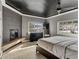 Main bedroom with fireplace, large window, and dark ceiling at 2800 Ashby Ave, Las Vegas, NV 89102