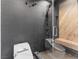 Modern shower with gray tile and built-in bench at 2800 Ashby Ave, Las Vegas, NV 89102