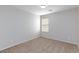 Bedroom featuring neutral walls and carpet and a window with horizontal blinds at 312 Bella Calabria Ave, Las Vegas, NV 89183
