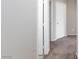 Hallway featuring neutral walls and carpet leading to the bedroom at 312 Bella Calabria Ave, Las Vegas, NV 89183