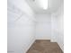Walk-in closet with installed shelving and carpeted floor at 312 Bella Calabria Ave, Las Vegas, NV 89183