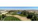 An aerial view of the golf course featuring a central lake and a view of the city at 334 Sea Rim Ave, Las Vegas, NV 89148