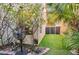 Small backyard with artificial grass, fan and storage shed, offering a private and low-maintenance outdoor retreat at 334 Sea Rim Ave, Las Vegas, NV 89148