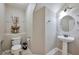 Half bathroom with a pedestal sink and decorative accents on the walls at 334 Sea Rim Ave, Las Vegas, NV 89148