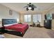 Bedroom featuring carpet flooring, an exercise bike, and natural light at 334 Sea Rim Ave, Las Vegas, NV 89148