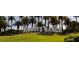 The manicured entrance to Rhodes Ranch features the community name and lush landscaping with palm trees at 334 Sea Rim Ave, Las Vegas, NV 89148