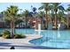 Community pool with inviting, clear waters, surrounded by palm trees, and stone accents at 334 Sea Rim Ave, Las Vegas, NV 89148