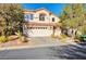 Charming two-story home featuring a well-maintained front yard and a spacious two-car garage at 334 Sea Rim Ave, Las Vegas, NV 89148
