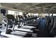 An array of treadmills in the gym, all lined up and ready for a great workout at 334 Sea Rim Ave, Las Vegas, NV 89148