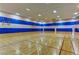 Large basketball court with blue and white painted walls in a well-lit gymnasium at 334 Sea Rim Ave, Las Vegas, NV 89148