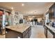 Open kitchen with granite counters, stainless appliances, an island, and seamless flow to the adjoining living spaces at 334 Sea Rim Ave, Las Vegas, NV 89148