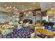 A formal hotel lobby featuring a fireplace, chandelier, dark wooden piano and elegant furniture at 334 Sea Rim Ave, Las Vegas, NV 89148