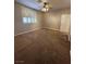 Spacious carpeted bedroom with large window and ceiling fan at 336 Brilliant Summit Cir, Henderson, NV 89052