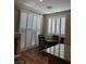 Kitchen dining area with wood floors and white shutters at 336 Brilliant Summit Cir, Henderson, NV 89052