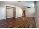 Spacious living room with hardwood floors and built-in shelving at 336 Brilliant Summit Cir, Henderson, NV 89052