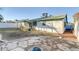 Large backyard, featuring a patio area and covered patio at 4323 E Twain Ave, Las Vegas, NV 89121