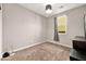 Small bedroom with carpet and window at 5444 White Barn Ct, North Las Vegas, NV 89081