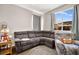 Relaxing living room with sectional sofa and large window at 5444 White Barn Ct, North Las Vegas, NV 89081