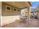 Covered patio with brick pavers and outdoor seating at 5444 White Barn Ct, North Las Vegas, NV 89081