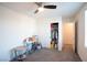 Bedroom with ceiling fan, closet, and small table at 5480 Enchanted Rose St, Las Vegas, NV 89148