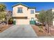 Two-story home with a two-car garage and a well-maintained front yard at 5536 Valensole Ave, Las Vegas, NV 89141