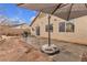 Spacious backyard with patio, grill, and shade umbrella at 6054 Sierra Medina Ave, Las Vegas, NV 89139