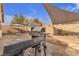 Backyard patio with built-in grill and shade sail at 6054 Sierra Medina Ave, Las Vegas, NV 89139