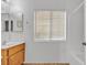 Clean bathroom with single sink vanity, shower/tub combo and window at 6054 Sierra Medina Ave, Las Vegas, NV 89139