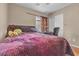 Well-lit bedroom with double bed and built-in workspace at 6054 Sierra Medina Ave, Las Vegas, NV 89139