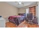 Cozy bedroom featuring a comfortable bed and a home office at 6054 Sierra Medina Ave, Las Vegas, NV 89139