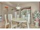 Elegant dining room with a large table, beautiful china cabinet, and floral arrangement at 6054 Sierra Medina Ave, Las Vegas, NV 89139