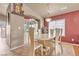 Spacious dining room with a large table and window, offering ample natural light at 6054 Sierra Medina Ave, Las Vegas, NV 89139