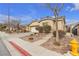 House exterior showcasing a garage and neat landscaping at 6054 Sierra Medina Ave, Las Vegas, NV 89139