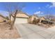 Single story house with a garage and desert landscaping at 6054 Sierra Medina Ave, Las Vegas, NV 89139