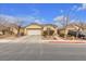 Single-story house with a two-car garage and landscaped front yard at 6054 Sierra Medina Ave, Las Vegas, NV 89139