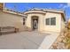Inviting front porch with a bench and decorative door at 6054 Sierra Medina Ave, Las Vegas, NV 89139