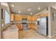 Well-equipped kitchen with stainless steel appliances and light wood cabinets at 6054 Sierra Medina Ave, Las Vegas, NV 89139