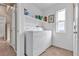 Convenient laundry room with washer, dryer, and shelving at 6054 Sierra Medina Ave, Las Vegas, NV 89139