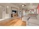 Spacious living room featuring hardwood floors and a sectional sofa at 6054 Sierra Medina Ave, Las Vegas, NV 89139