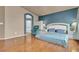 Main bedroom with king-size bed, hardwood floors and access to en-suite bathroom at 6054 Sierra Medina Ave, Las Vegas, NV 89139