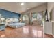 Spacious main bedroom with a large bed, hardwood floors, and ample natural light at 6054 Sierra Medina Ave, Las Vegas, NV 89139